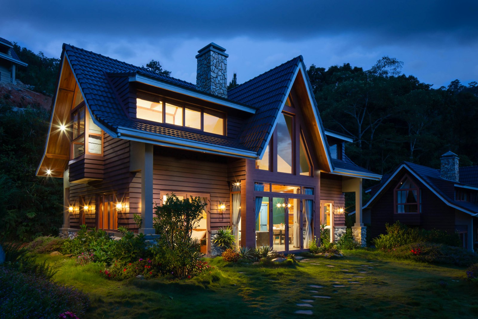 A modern residential home exterior at dusk representing a single-family rental property